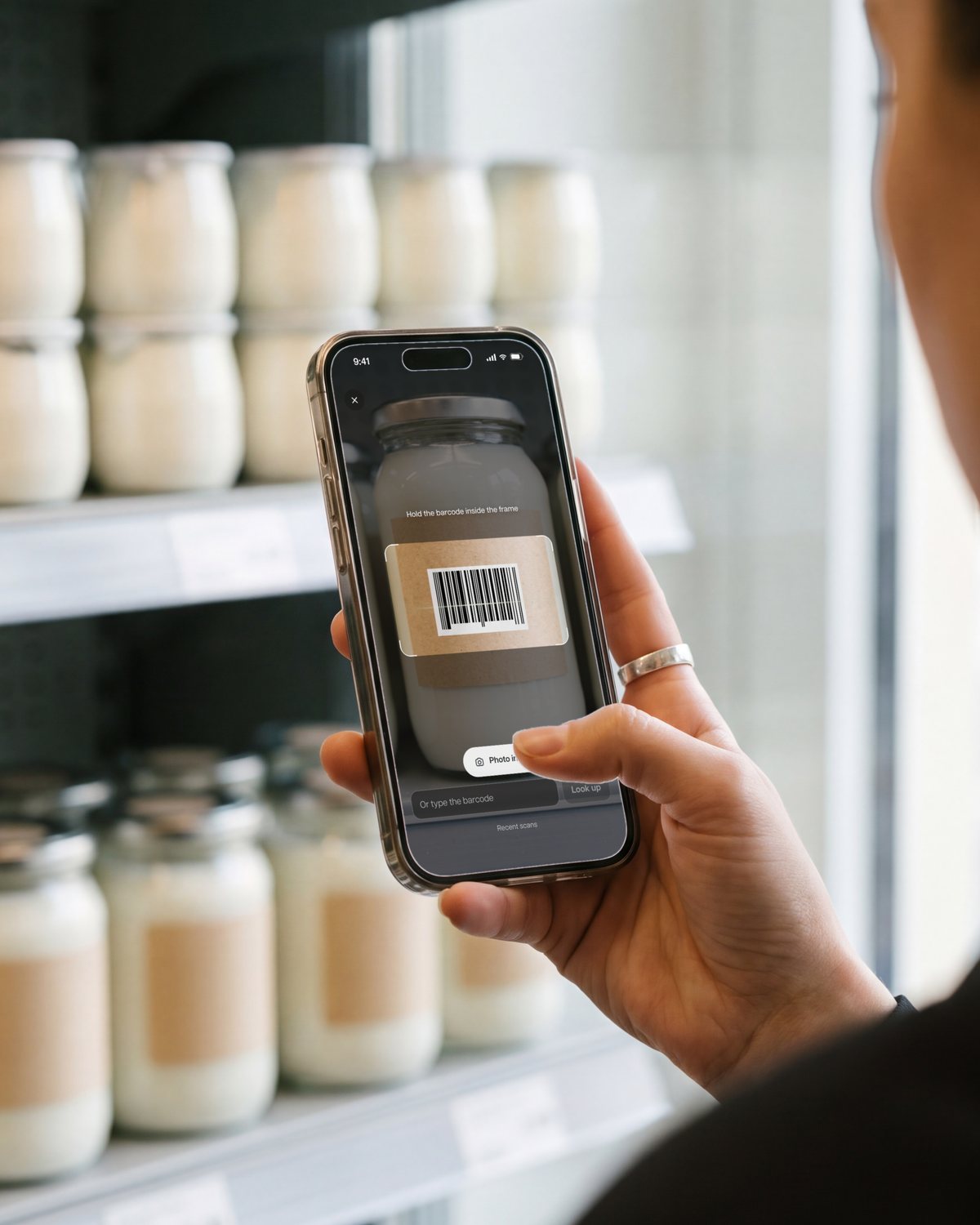 Scanning the barcode of a jar with Kata in a supermarket aisle